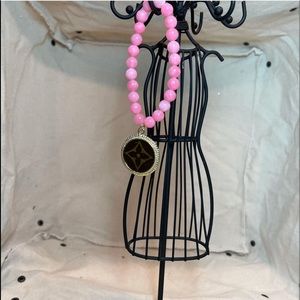 Light pink jade 8mm bead bracelet embellished with a gold flower bezel.